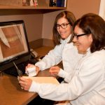 Photo of Drs. Trager and Rebhun at work